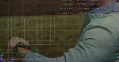 Person Using Smartwatch with Stock Data Overlay