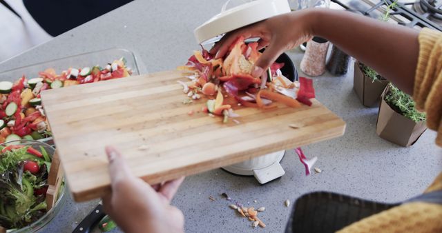 Person Preparing Fresh Vegan Salad and Disposing Vegetable Scraps - Download Free Stock Images Pikwizard.com