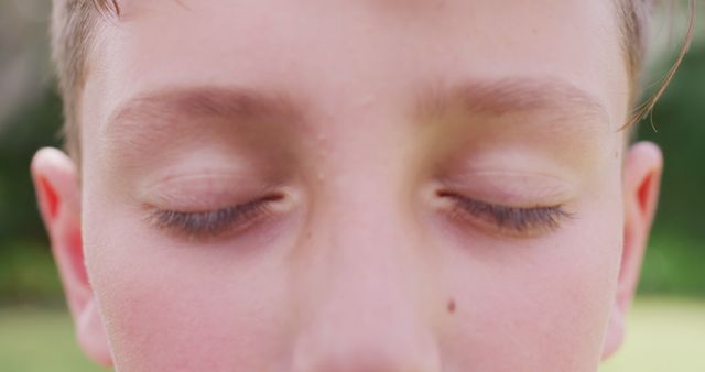 Close-up of Child with Closed Eyes Outdoors on Sunny Day - Download Free Stock Images Pikwizard.com