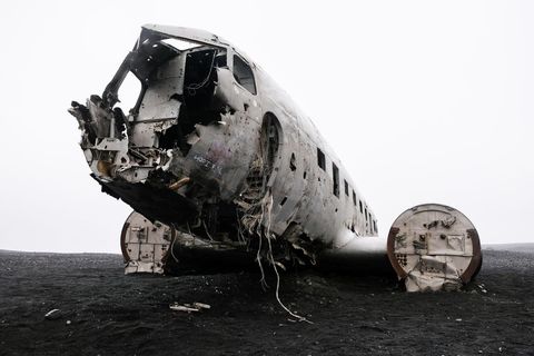 Abandoned plane crash wreck in iceland on black sand beach
