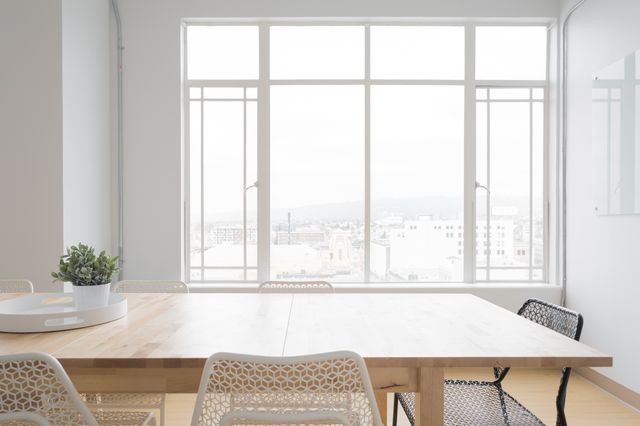 Minimalist Office Dining Area with Large Window and City View - Download Free Stock Photos Pikwizard.com