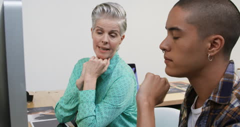 Collaborative Office Discussion Between Diverse Coworkers