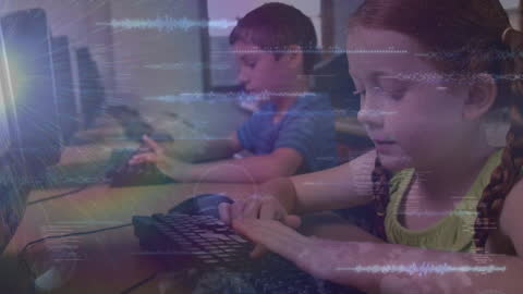 Young Students Learning Computer Skills in Classroom