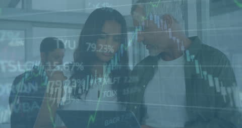 Business Professionals Analyzing Financial Data with Graph Overlays