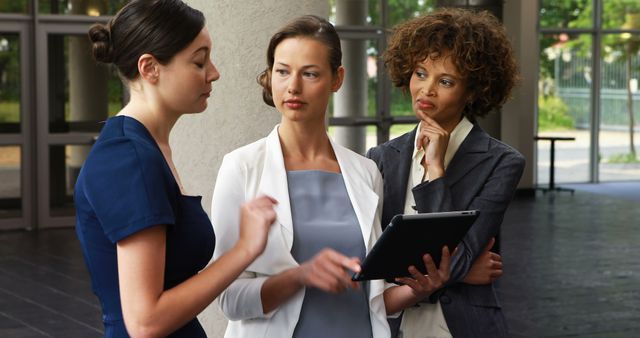 Diverse Businesswomen Discussing Work in Modern Office Building - Download Free Stock Images Pikwizard.com