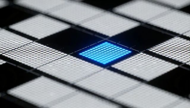 Single blue microcell glowing on glossy sensor grid macro technology background for ai design