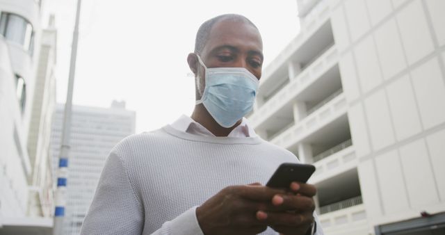 Man Wearing Face Mask Using Smartphone in Urban Environment - Download Free Stock Images Pikwizard.com