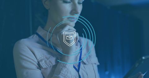 IT Technician Analyzing Cybersecurity Data with Shield Icon Overlay - Download Free Stock Images Pikwizard.com