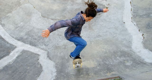 Young man practicing skateboard tricks at skatepark - Download Free Stock Images Pikwizard.com