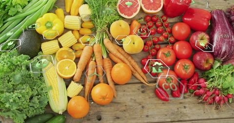 Fresh organic vegetables with eco-friendly symbols on wooden table