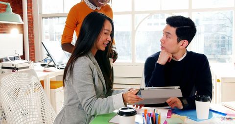 Diverse Business Team Discussing at Modern Office Table - Download Free Stock Images Pikwizard.com