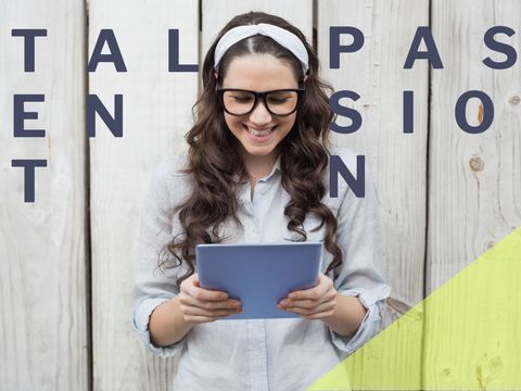 smiling woman using tablet for online learning - Download Free Stock Templates Pikwizard.com