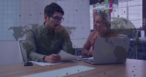 Collaborative Business Strategy Meeting with Digital Interface