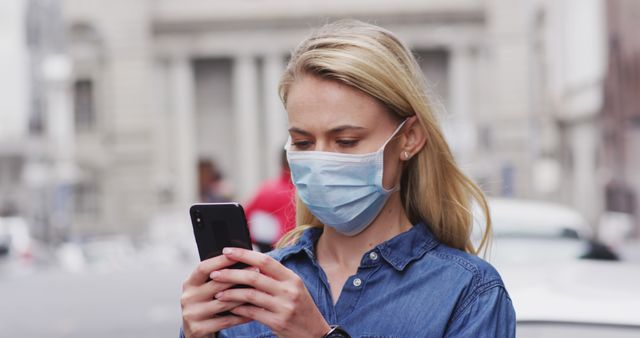 Young Woman Wearing Mask Texting on Smartphone Outdoors - Download Free Stock Images Pikwizard.com