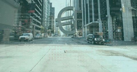 Euro symbol decal on wet glass over downtown street reflecting finance and urban commerce