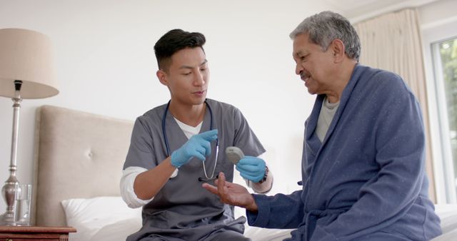 Nurse Assisting Elderly Man With Blood Pressure Check at Home - Download Free Stock Images Pikwizard.com