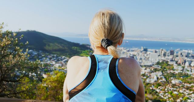 Woman Overlooking Cityscape After Exercise - Download Free Stock Images Pikwizard.com