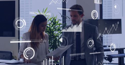 Business professionals analyzing data charts for success