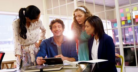 Diverse Team Collaborating Using Digital Tablet in Modern Office - Download Free Stock Images Pikwizard.com