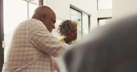 Retired Couple Enjoying Meal Together in Sunlit Dining Room - Download Free Stock Images Pikwizard.com