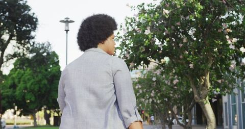 Plus Size Woman Walking with Luggage in City, Celebrating Body Inclusivity