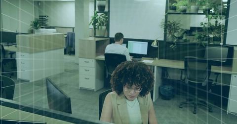 Modern Open Office with Professional Workers and Greenery