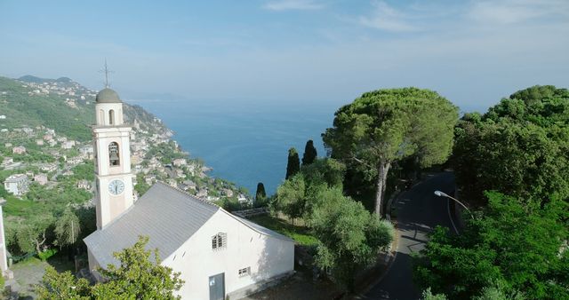 Picturesque Cliffside Church Overlooking Serene Coastal Sea - Download Free Stock Images Pikwizard.com