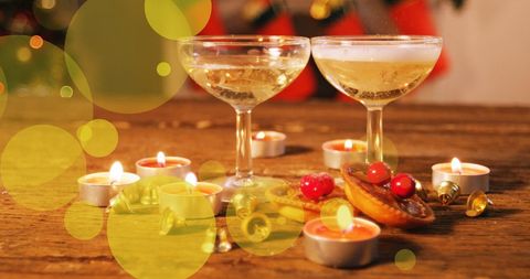 Festive Holiday Celebration with Champagne and Candlelight - Download Free Stock Images Pikwizard.com