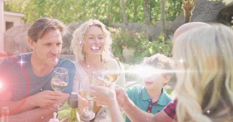 Backyard Family Gathering Celebrating with Wine Toasts