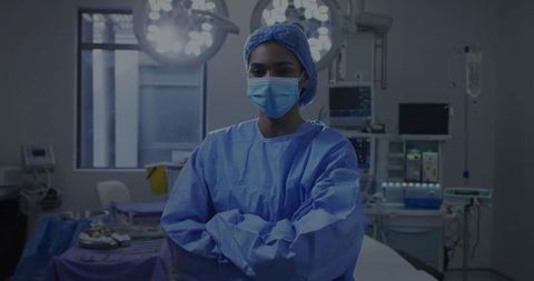 Confident surgeon in operating room with surgical equipment