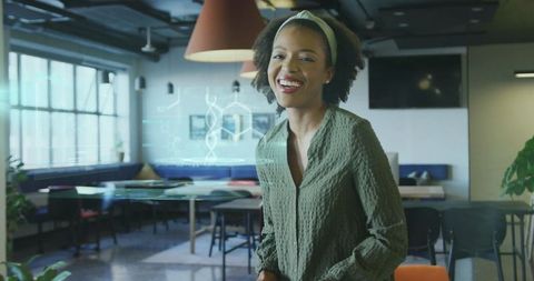 Innovative Scientist Using Holographic DNA in Modern Office Lounge