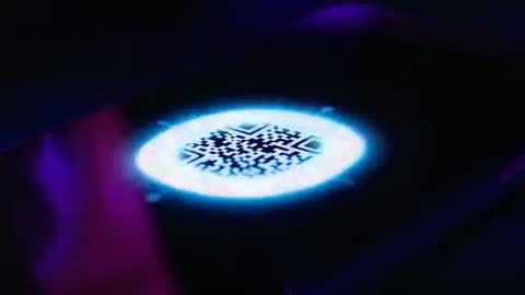 Neon Blue QR Code Scan Animation Smartphone Screen with Pulsing Reticle and Magenta Glow