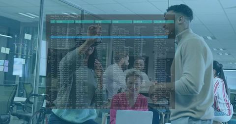 Collaborating Coworkers Pointing at Code Overlay on Glass Partition in Open Office