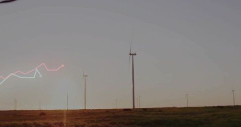Wind turbines with graphical overlay during sunset