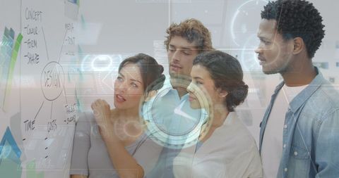 Diverse Team Collaborating on Data-Driven Project with Futuristic Interface - Download Free Stock Images Pikwizard.com