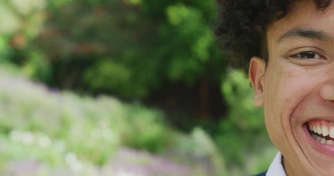 Smiling Young Man at Outdoor Wedding Celebration