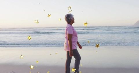 Stylized Portrait of Elderly Woman Walking by Ocean at Sunset with Glittering Starry Effect