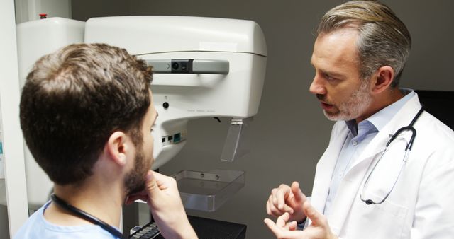 Doctors discussing mammogram results in medical clinic - Download Free Stock Images Pikwizard.com