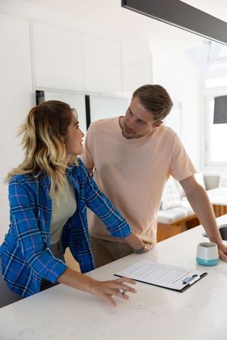 Couple Collaborating in Modern Kitchen on At-Home Project