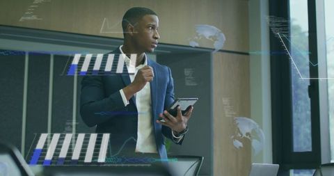 Business Executive Analyzing Digital Data on Tablet in Modern Office