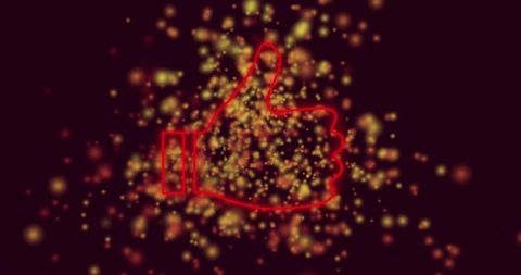 Neon thumbs-up with glowing particles on maroon