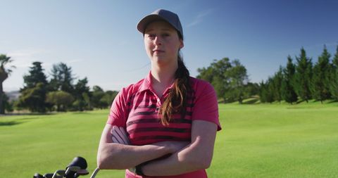 Confident Female Golfer Relaxing on Sunny Green - Download Free Stock Images Pikwizard.com