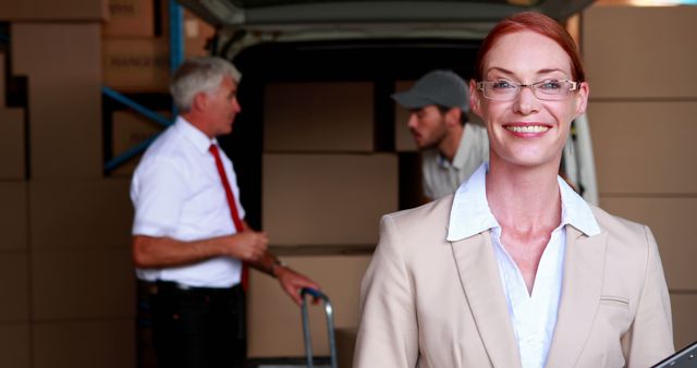 Successful businesswoman overseeing warehouse operations - Download Free Stock Images Pikwizard.com