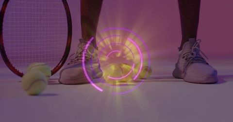 Athlete feet in gray sneakers beside tennis racket and balls with neon holographic overlay