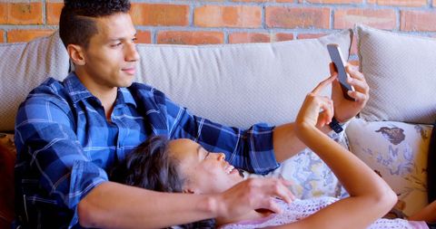 Young Latino Couple Sharing Moments on Smartphone - Download Free Stock Images Pikwizard.com