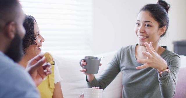 Young People Engaging in Friendly Conversation at Home - Download Free Stock Images Pikwizard.com