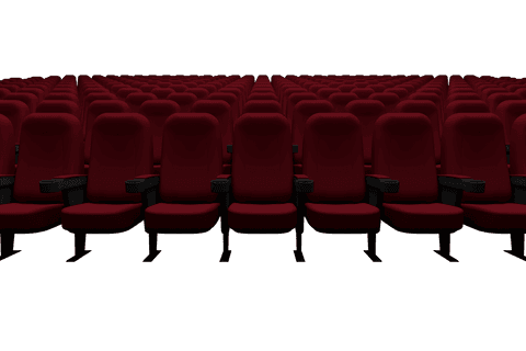 Empty cinema seating with red auditorium chairs on transparent