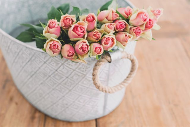 Pink Roses in White Basket on Wooden Surface - Download Free Stock Photos Pikwizard.com