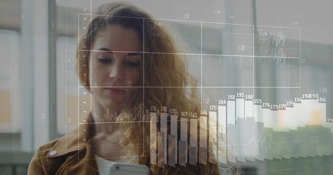 Businesswoman Analyzing Data on Digital Interface with Smartphone