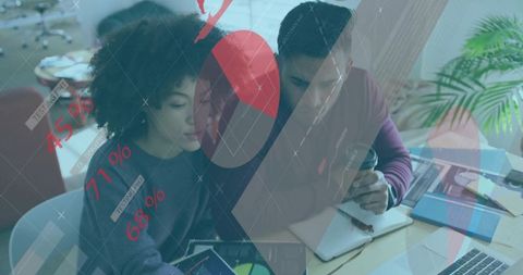 Office professionals analyzing financial data in modern workspace